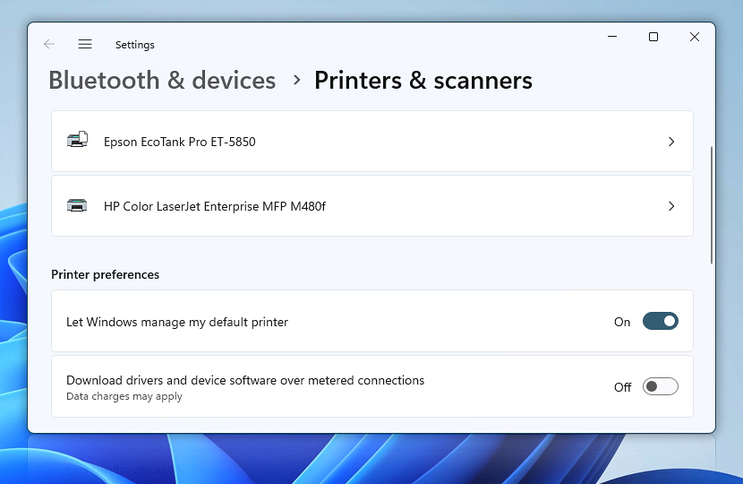 Settings · Printers & scanners · Let Windows manage my default printer